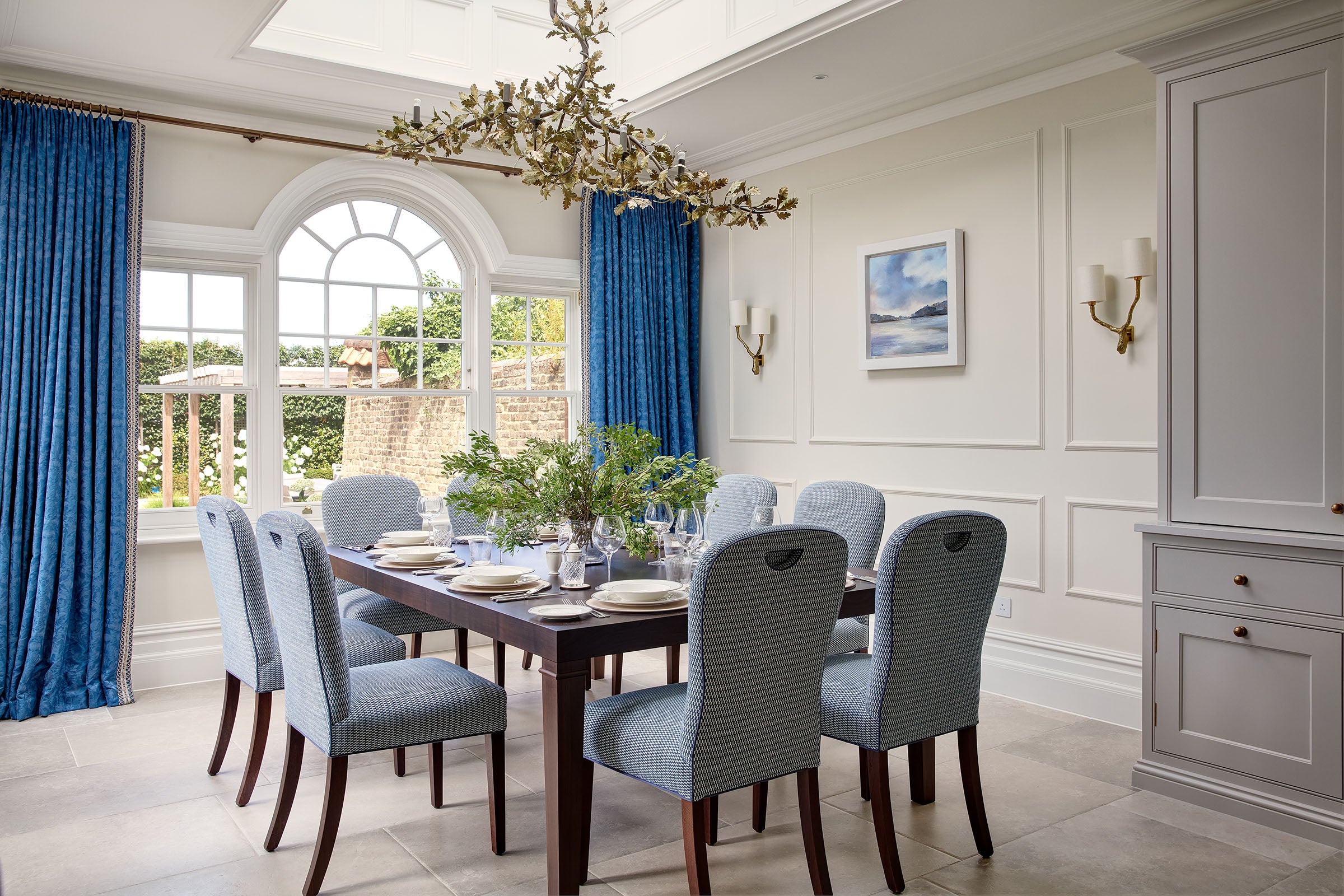 Grand dining room curtains in opulent silk from Gainsborough silk on hand finished bronze pole over statement window