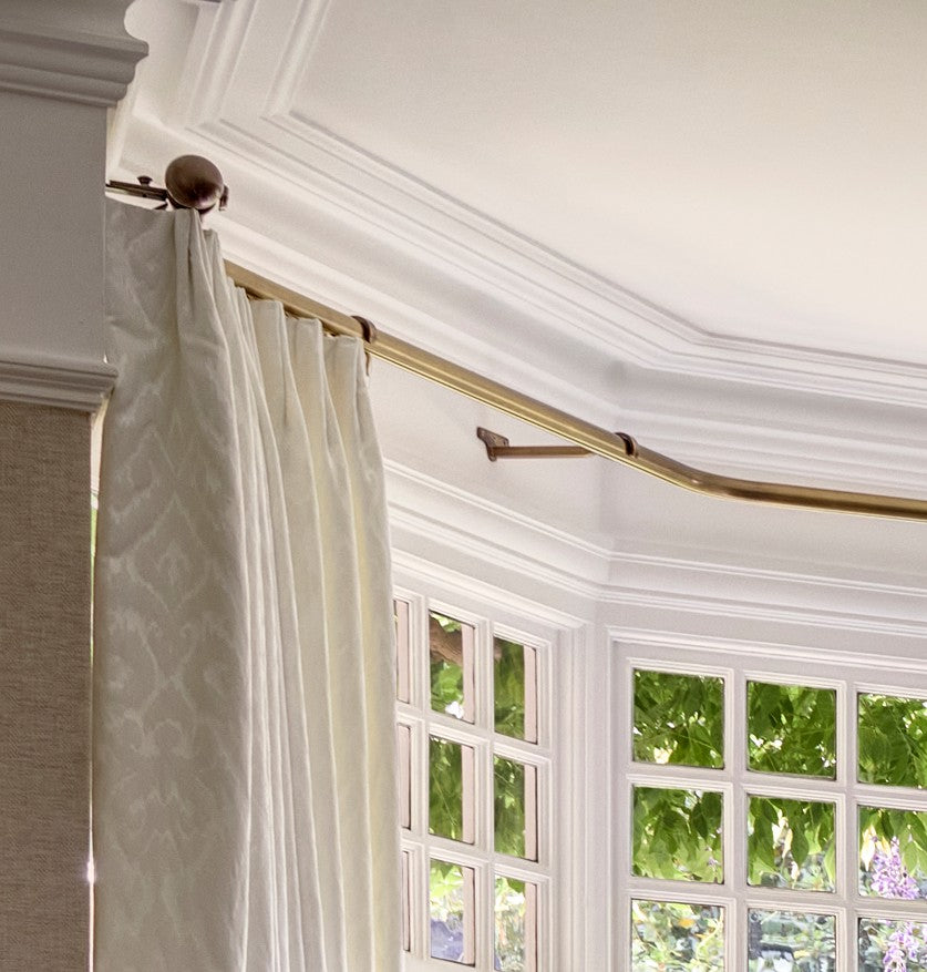 Curved bay window pole in antique brass
