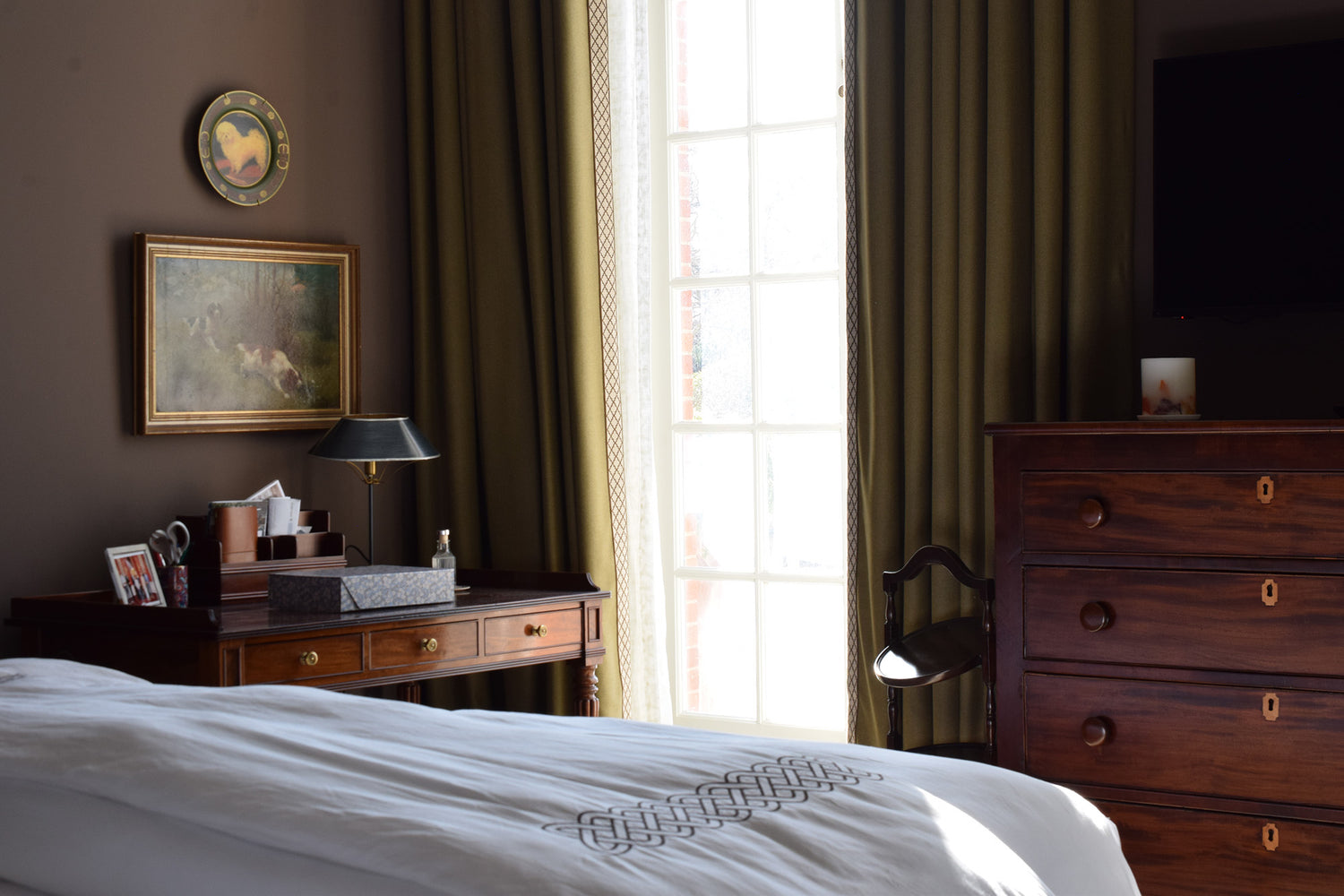 Rich Holland and Sherry pure wool fabric for curtains in moody bedroom in London