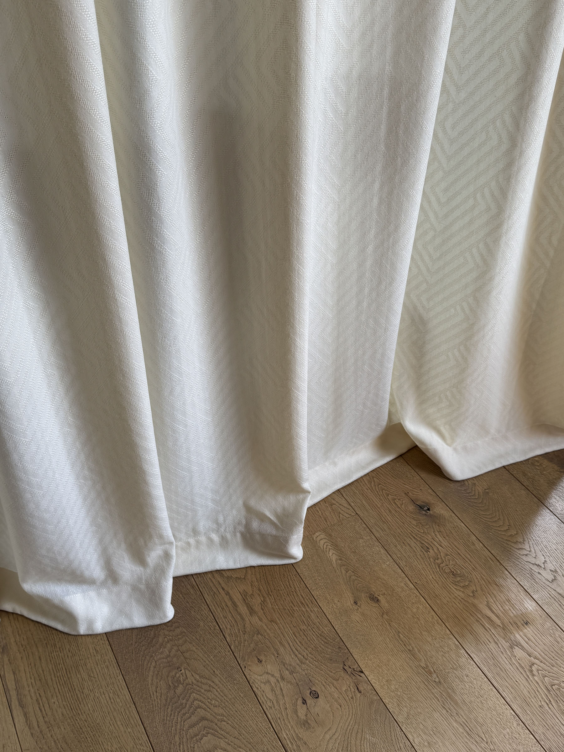 Sheer curtain break showing elegant drapery