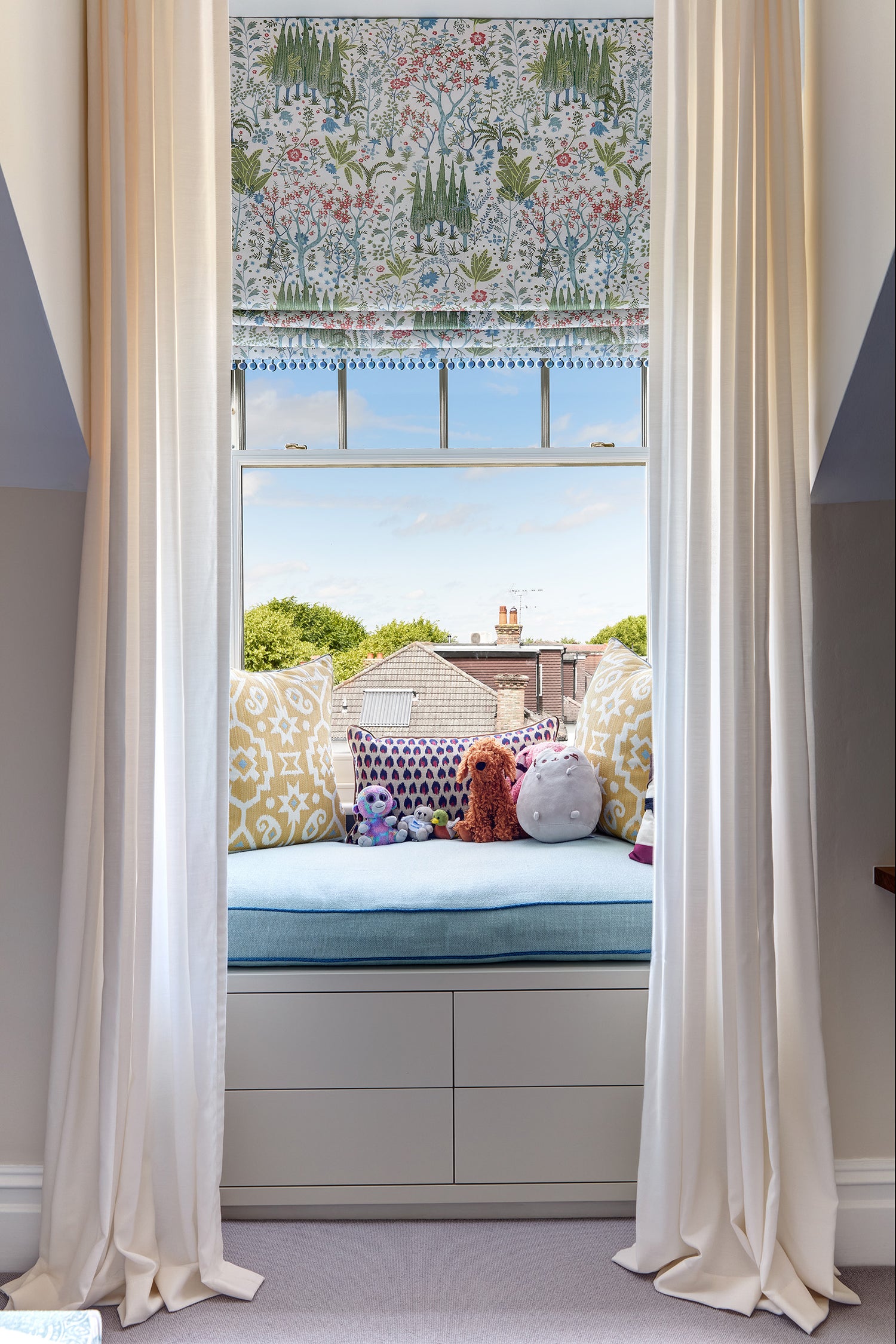 Children's bedroom curtain and Roman blind scheme using GP J Baker and Zimmer and Rohde fabrics, with window seat using Pierre Frey