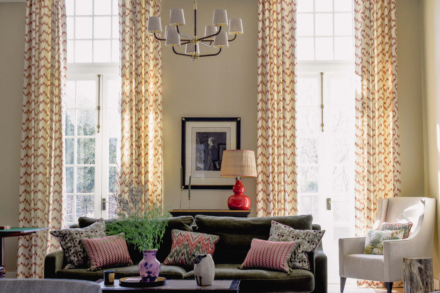 Modern tall abstract curtains in red and cream with fabric from Lee Jofa in this Richmond apartment